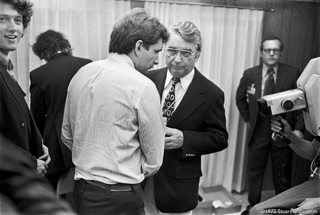 Bill Clinton, Rick Stearns, Wisconsin Gov. Pat Lucey and CBS Correspondent Bob Schieffer in the McGovern command trailer behind the stage of the 1972 Democratic National Convention
 – © 1972 Stuart Bratesman